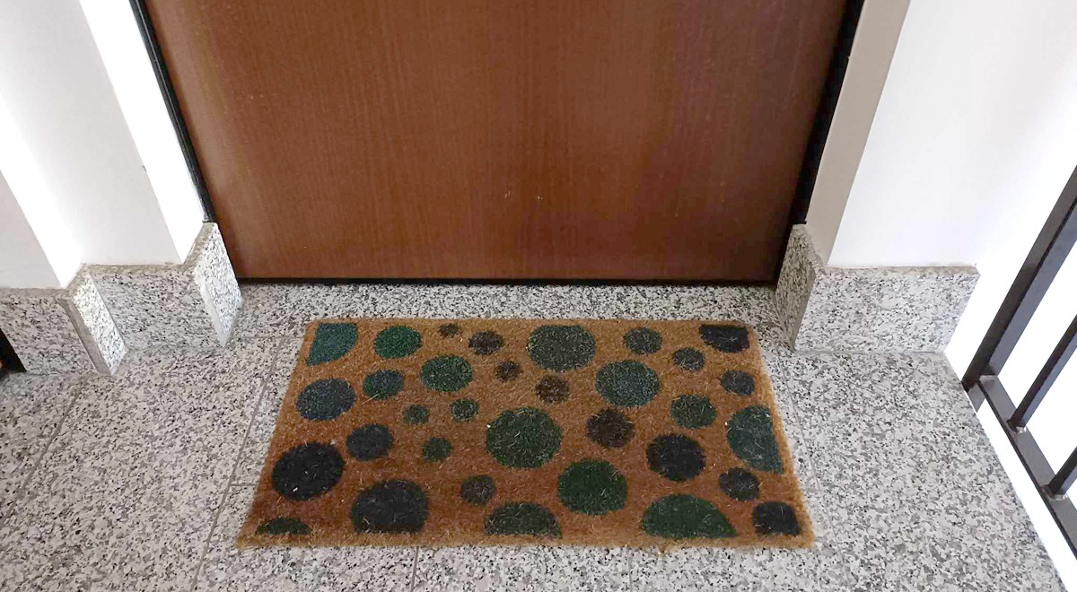 Many people put two pins under their doormat at home why?