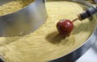 Watch this mesmerizing production of caramel apples ...