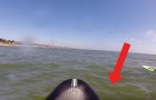 She goes out on a paddle board -- look what happens! Wow!