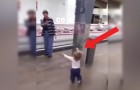 A little girl strolls through a supermarket ...