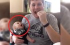 Papa eet chips: let goed op het kleintje dat hij in zijn armen heeft... is het niet aandoenlijk!
