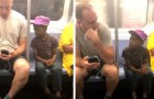  A young boy continues to peek at a man's smartphone, so he gives it to the boy and allows him to play instead