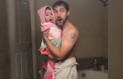 A father sings with his little daughter after she takes a shower and the tenderness of the scene will melt your heart