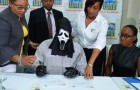 He wins the lottery and goes to collect the prize wearing a mask so as not to be recognized by greedy relatives