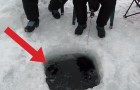 Some people are ice fishing : you won't believe what comes out of the hole!!