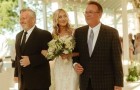 Her father accompanies his daughter to the altar but as she walks down the aisle she also invites her stepfather to join them