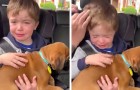 Cet enfant serre dans ses bras son premier chiot et n'a pu retenir ses larmes d'émotion (+VIDEO)