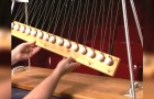 He puts a piece of wood under 15 balls: when he lets them go...you'll be mesmerized !