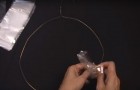 She ties plastic bags on a coat hanger and creates an amazing decoration!