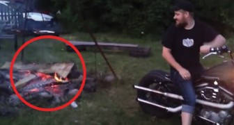 The firewood has been lit but needs a boost! A guy decides to use his Harley Davidson!