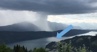 Tsunami dal cielo: il momento in cui un'immensa nuvola scarica tonnellate d'acqua in un lago alpino