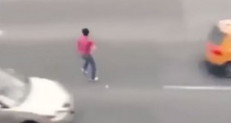 This guy must be insane crossing a road like this !