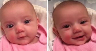 A little girl of only 8 weeks says I love you to mom and can't stop smiling at her
