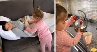 Loving 4-year-old takes care of her sleeping mother: she brings her tea and tucks in her blanket