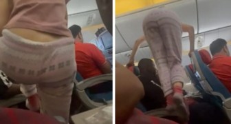 En passagerare på ett flygplan kliver över folk för att nå sin plats: resenärerna blir förbannade (+VIDEO)