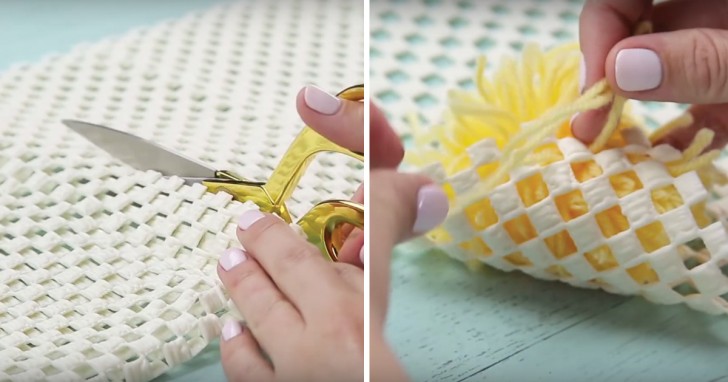 Cut out the anti-slip rug canvas to the shape and size you want, and tie one pom-pom to one of its ends.