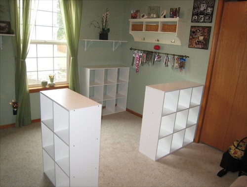 First, Vikkie's husband placed the three bookshelves from IKEA in the exact position where the future desk would be located.