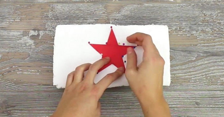 1. Get the shape you want to create (in this case a star), place it on a piece of polystyrene, and trace out the outline with pins.