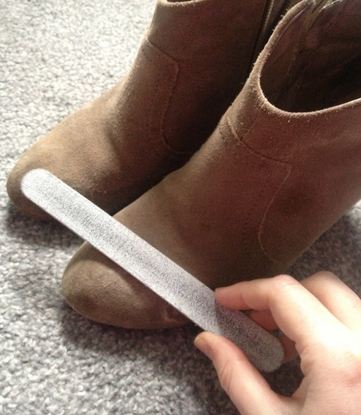 Use a nail file to remove dirt from suede shoes.