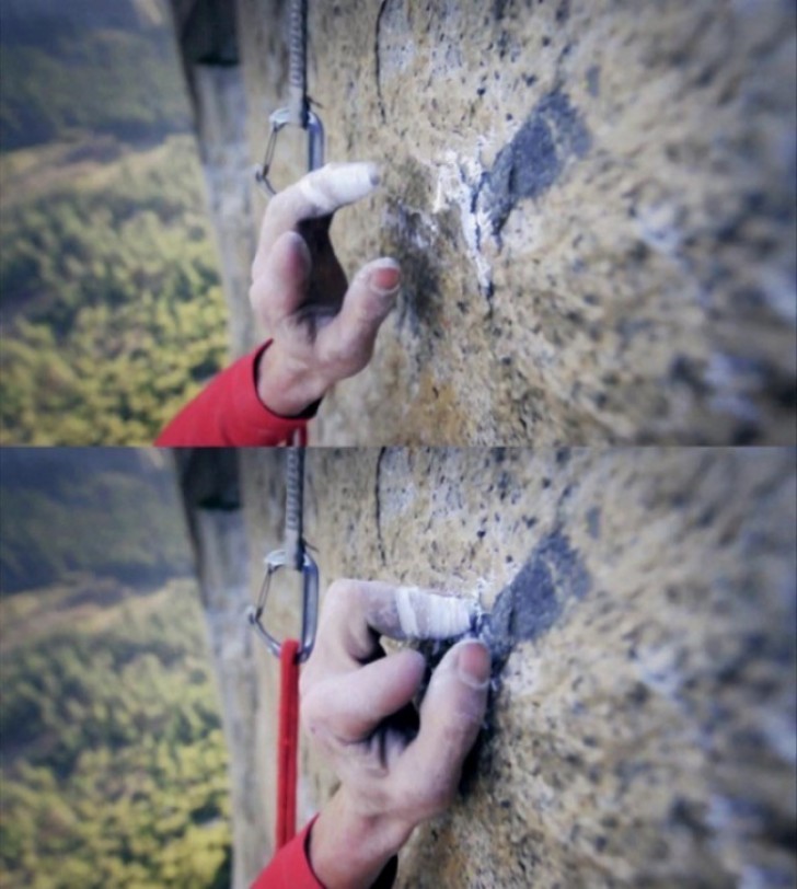 12. Un arrampicatore professionista alle prese con una parete scoscesa che sta mettendo la scalata a dura prova.
