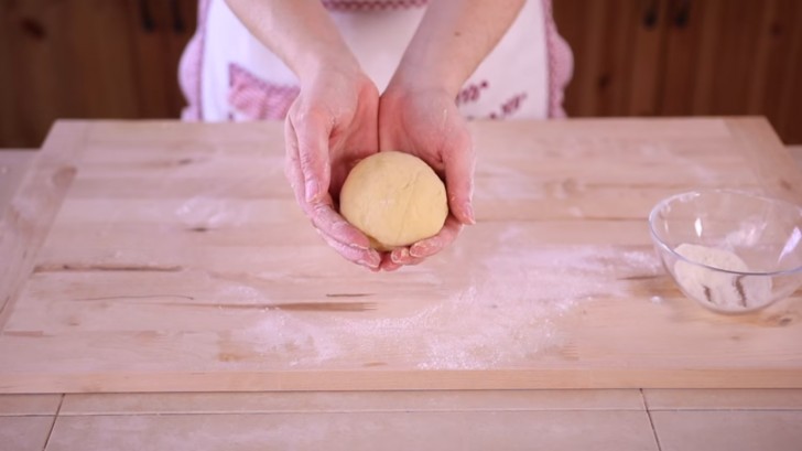 Knead the ingredients with your hands and when you have formed a ball, place it on the work surface and continue kneading until the dough is elastic and soft but not sticky!