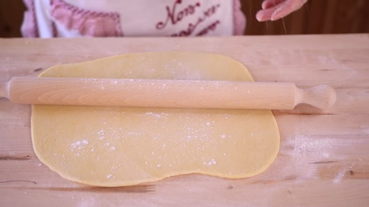 Use a rolling pin to make the dough as thin and as square-shaped as possible.