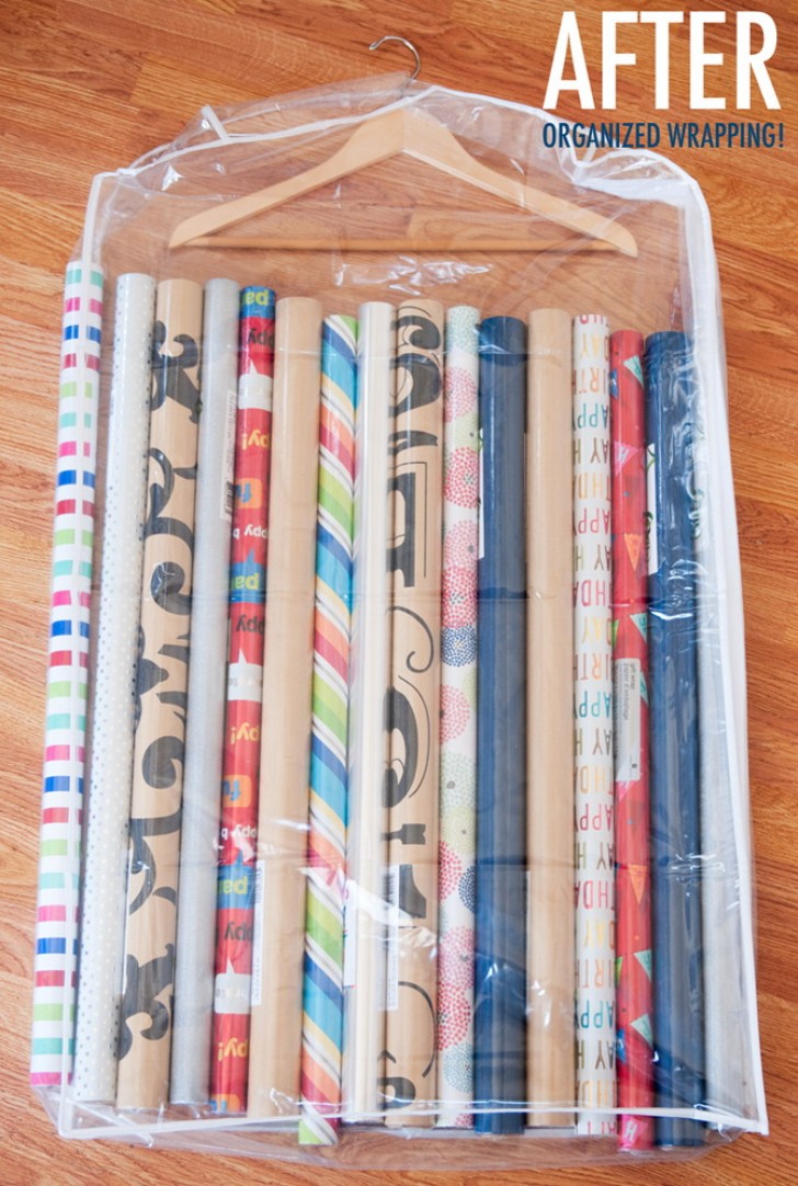 9. Have you accumulated a lot of rolls of gift paper? Place them in a transparent bag, one of those for storing coats, and hang with a clothes hanger.