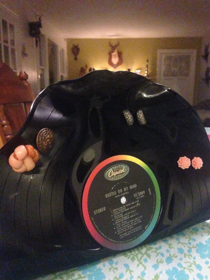 Last but not least, try creating an interesting earring holder by simply drilling holes in a vinyl record!