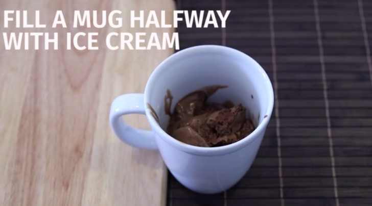 2. Fill the mug half full of chocolate ice cream and let this melt a little.