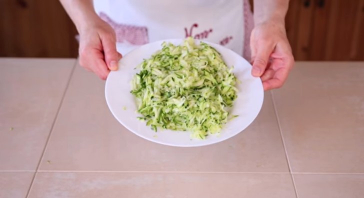 1. Grate the zucchini so that it looks the same way it does in the image.