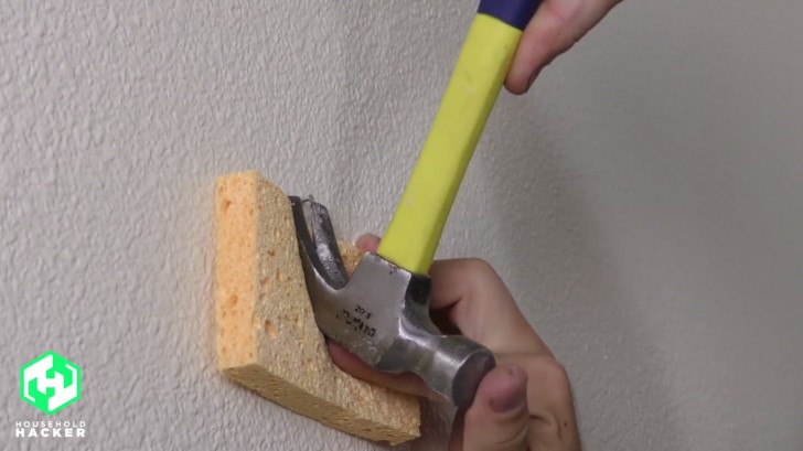 4. To avoid ruining a wall, place a kitchen sponge under the hammer when you remove a nail.
