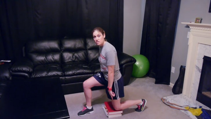 Exercise 2 --- Bring a leg in front of the books and bend it to 90° angle to bring the other knee in direct contact with the books.