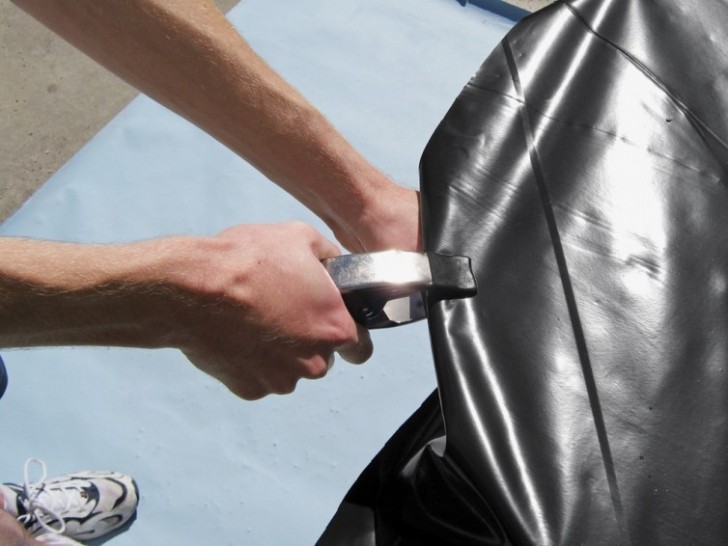 3. Use pliers to hold the plastic sheeting in place.