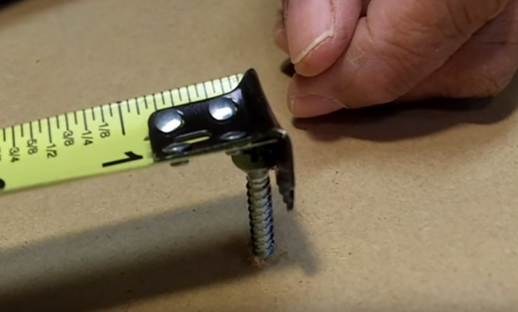 The hole is used to hook the tape measure to a screw that can be used as a holder.