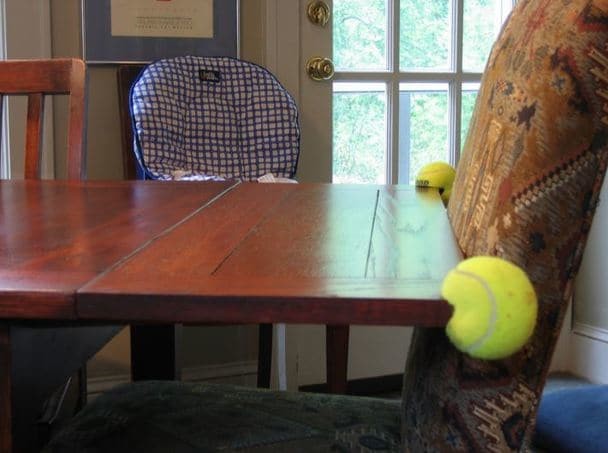 3. Tired of heads getting bumped on the corners of furniture? Simply create a slot in a tennis ball!