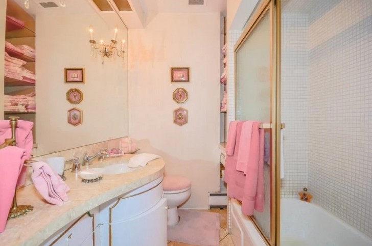 In the bathroom, various warm pink colors blend with gold