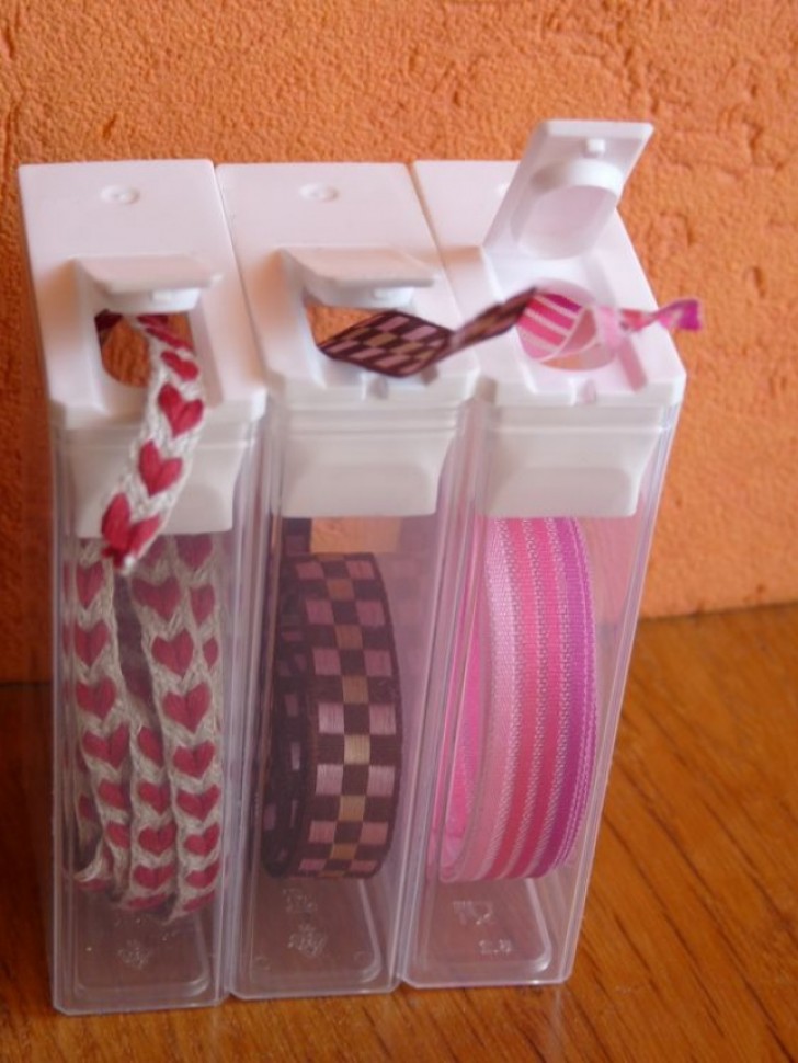 11. Use small plastic candy boxes to store your sewing tapes and ribbons.