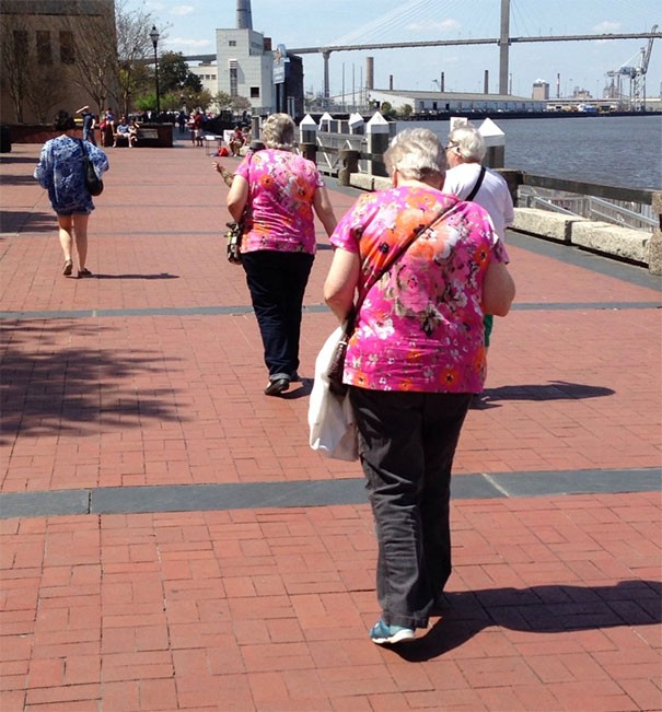 These two ladies must shop at the same clothing store.