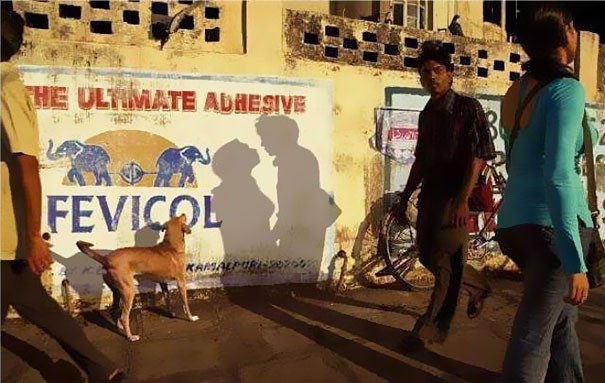 10. The astonishing shadows of two people walking in the opposite direction (and a dog that looks like it is watching them!).