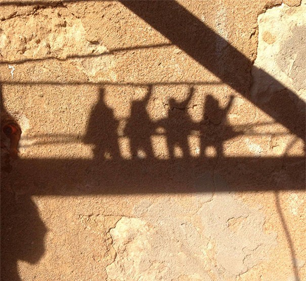 17. These are just clothespins attached to a clothesline, but they look exactly like the shadow profile of a rock band!