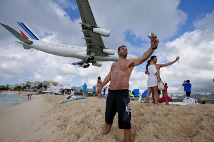 8. In San Martin, there is a public beach right next to the airport landing strip!