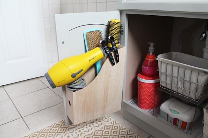 6. Attach a document holder inside a bathroom cabinet door and you will have extra space for many bathroom objects!