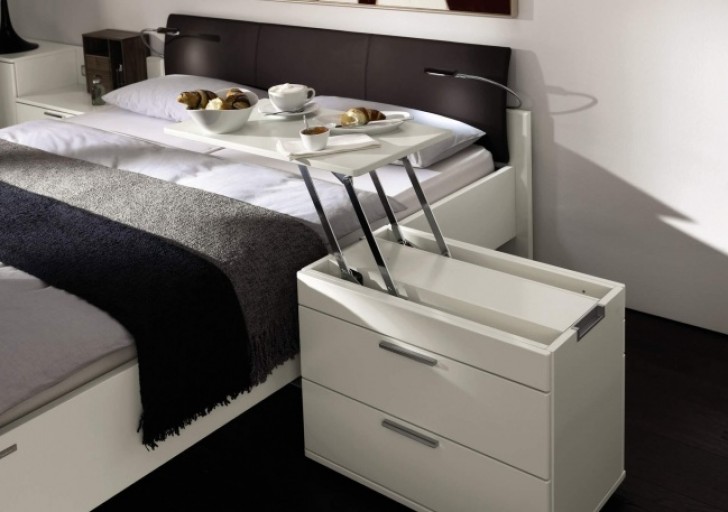 14. A bedside table which becomes a handy and convenient breakfast tray.