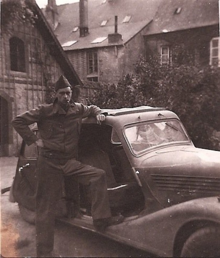 My grandfather with a car stolen from the Nazis during WWII.