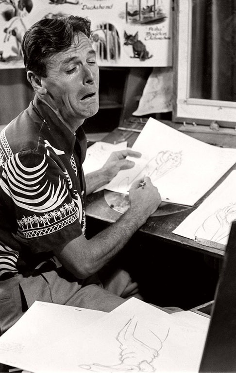 12. A Disney animator makes a grimace to help draw one of the Disney characters.