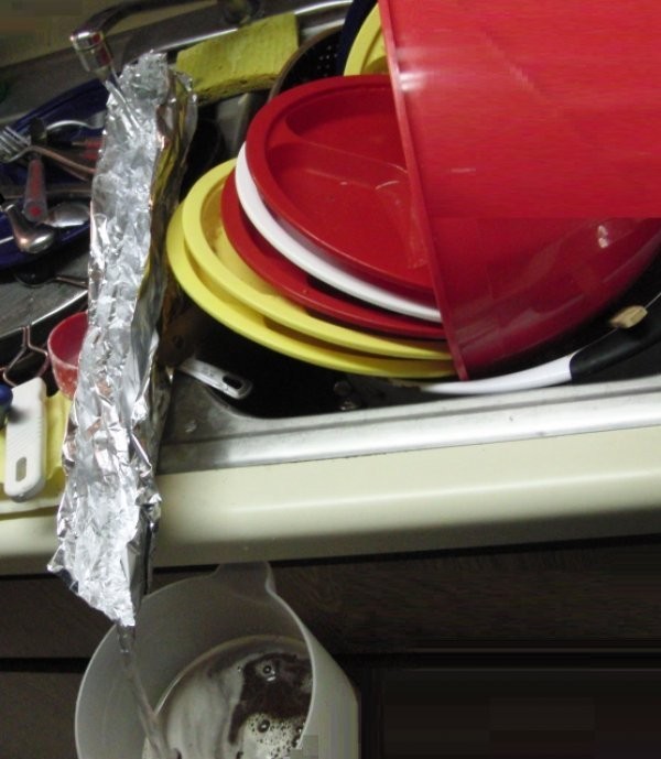 1. This person needed water from the tap, but the flow was hampered by a stack of dishes so instead of washing the dishes they found an alternative method ...