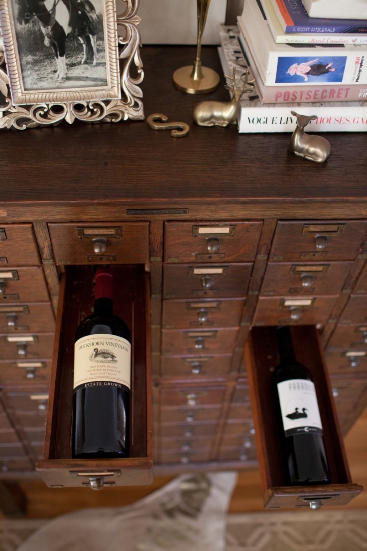 18. A wine storage cupboard with vintage wines