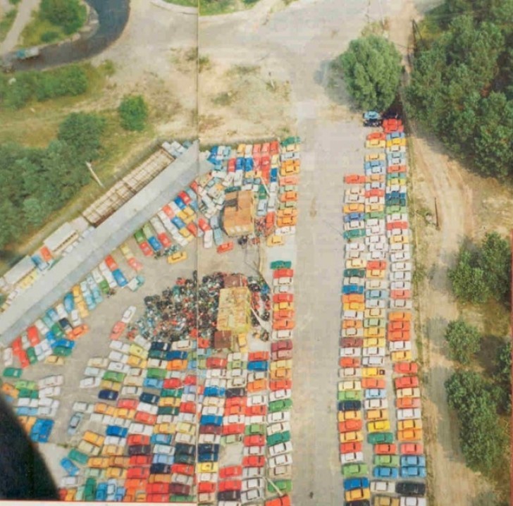 3. Cars abandoned in a parking lot, after the Chernobyl disaster.