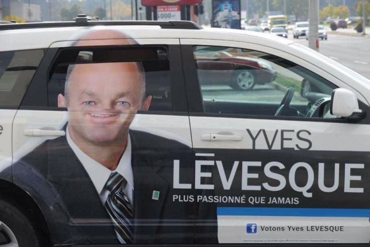 1. An advertisement that tries to portray a reassuring face ... it is a shame that that face is "fractured" by the car window, door, and roof!