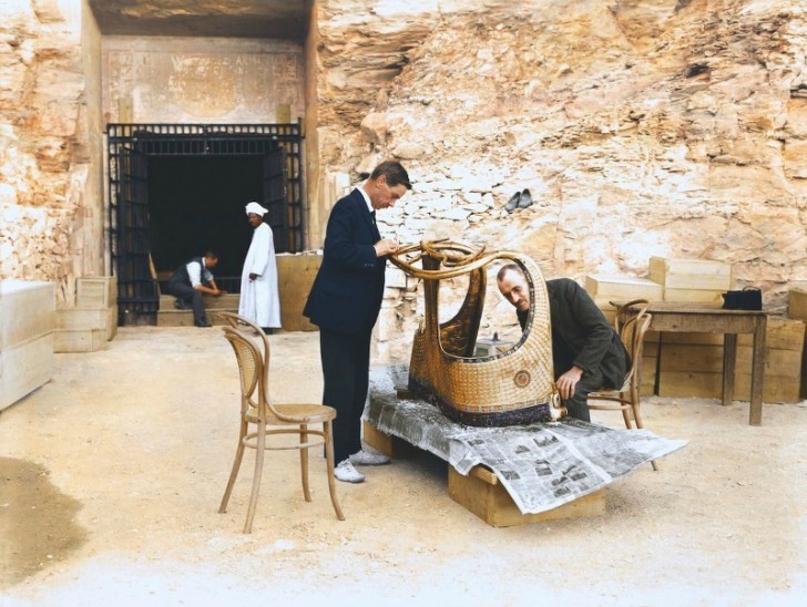 Arthur Mace and Alfred Lucas work on a golden chariot near the tomb of Seti II.